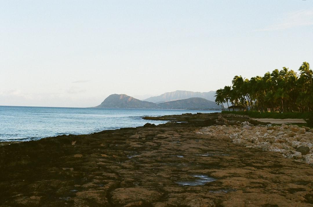 a view of the ocean from a rocky shore