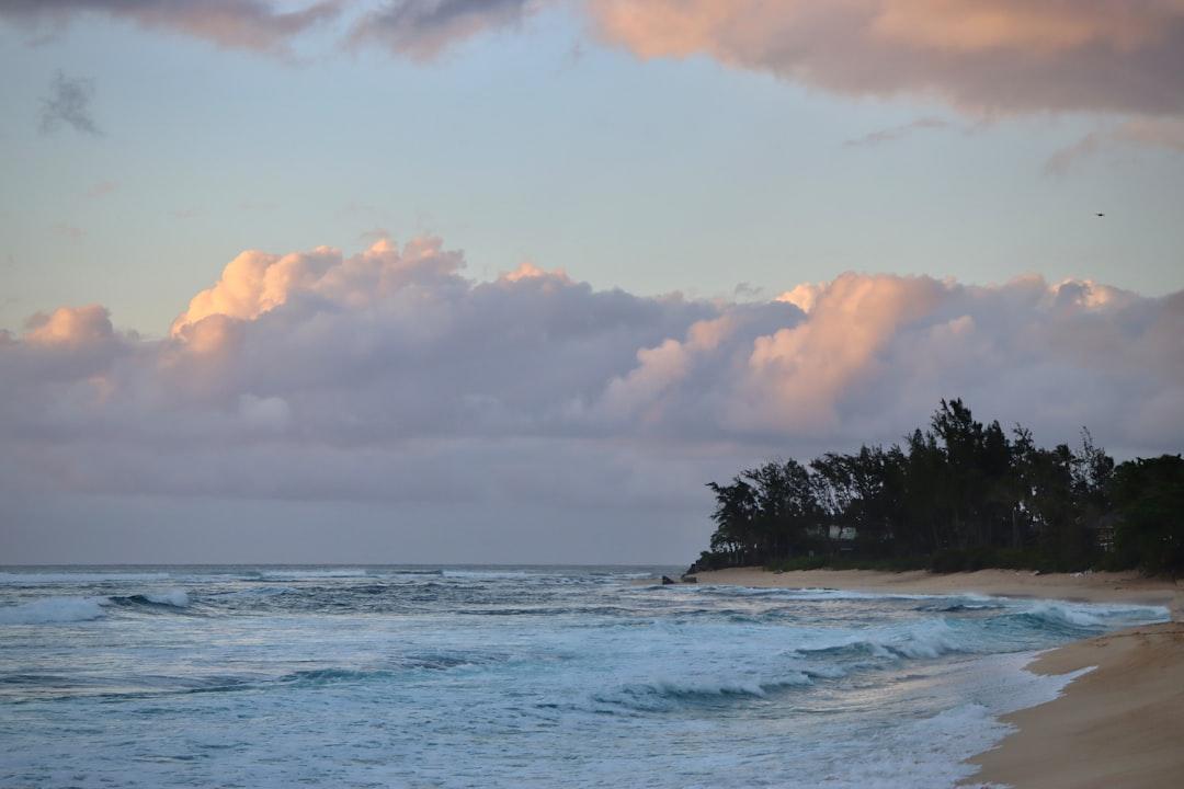 a beach with waves crashing on the shore