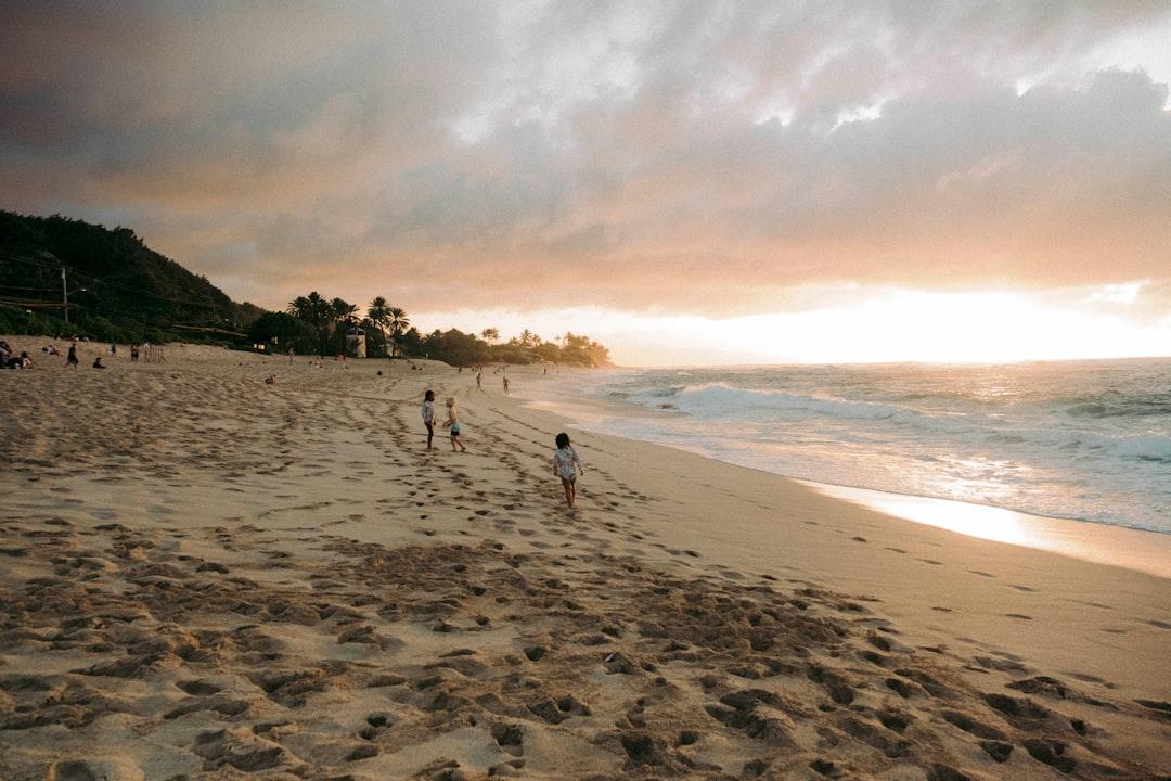 people walking on a beach
